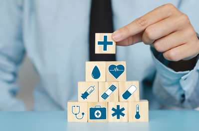 hand stacking blogs with healthcare and pharmacy icons