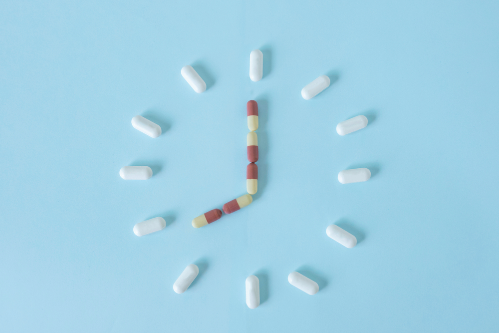 pills forming the shape of a clock