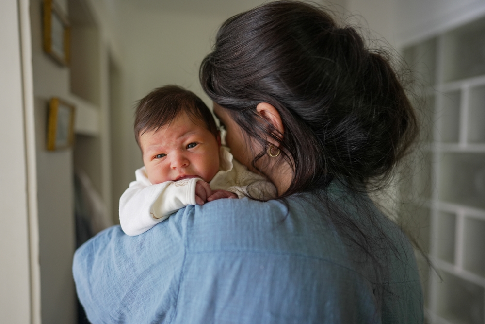 mom holding baby