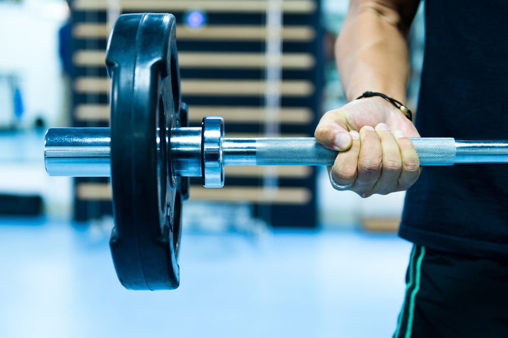 man lifting weights