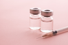 two vaccine vials and syringe