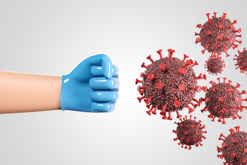 gloved hand fighting virus