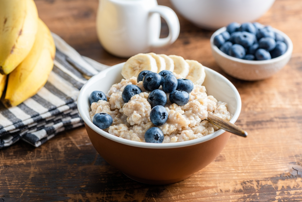 bowl of oatmeal with bananas and blueberries